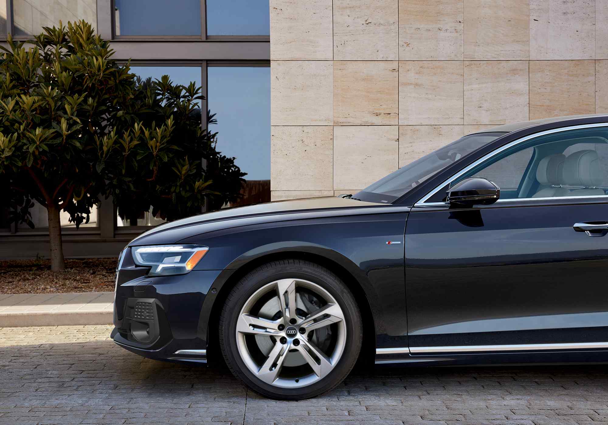 Close up of an Audi A8 side profile, parked.